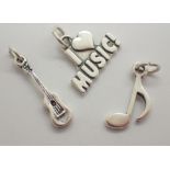 Three silver music charms