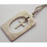 Silver fancy cross pendant on silver necklace