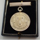 Hallmarked silver Royal Salop Infirmary Efficiency medal date 1954 with inscription