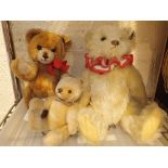 Three Steiff plush teddy bears with studs in ears