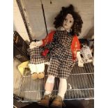 Limited edition porcelain doll with stand and another doll