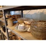 Two shelves of glass and ceramics