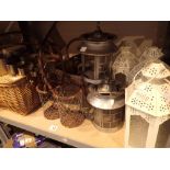 Outdoor candle holders with wicker baskets and a picnic set