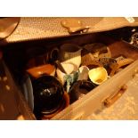 Vintage suitcase with mixed ceramic and glass contents