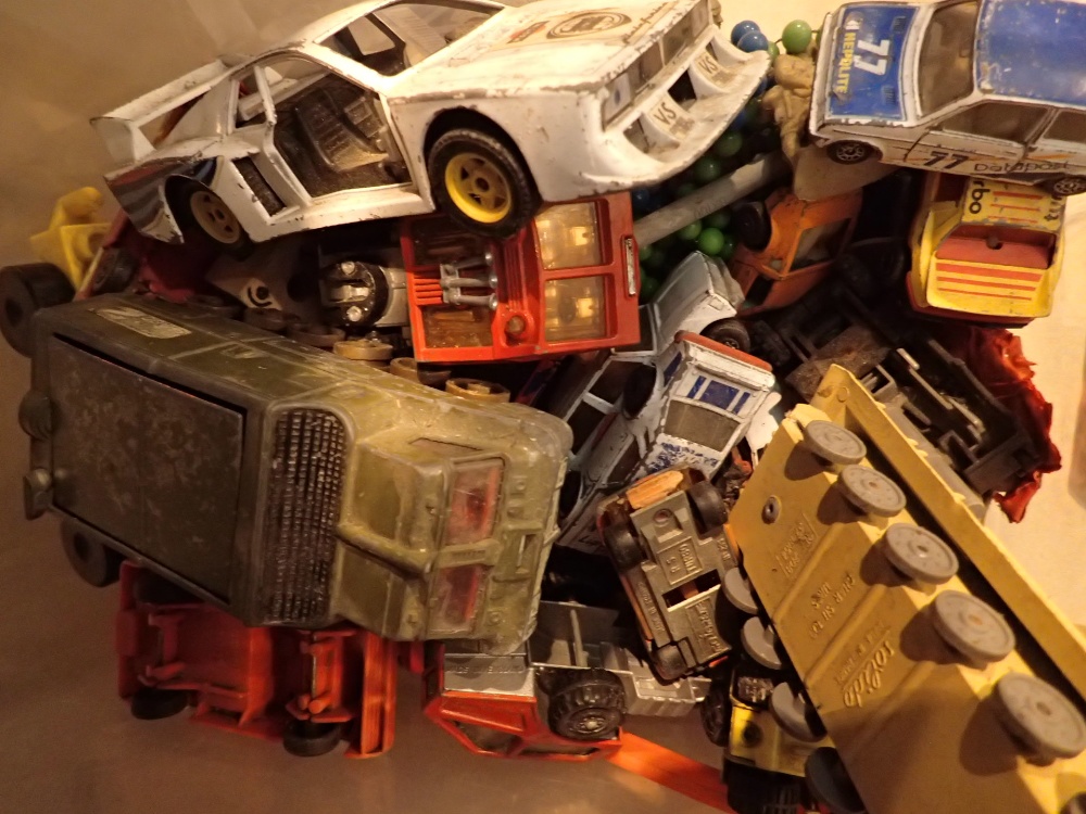 Box of playworn diecast cars