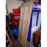 Three six panel pine doors in original plastic wrap CONDITION REPORT: This has never