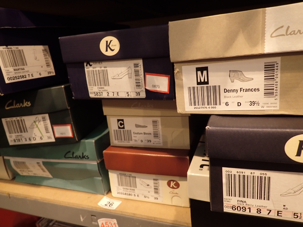 Shelf of ladies shoes mainly Clarks sizes 5 1/2 to 6 and boots
