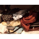 Shelf of ladies handbags and gloves mainly Tula