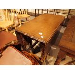 Oak dropleaf dining table with piecrust edge on barleytwist supports 128 x 90 cm