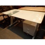 White glass topped desk with three drawe