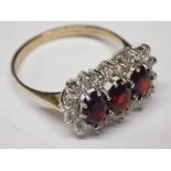 9ct gold garnet and white stone ring siz