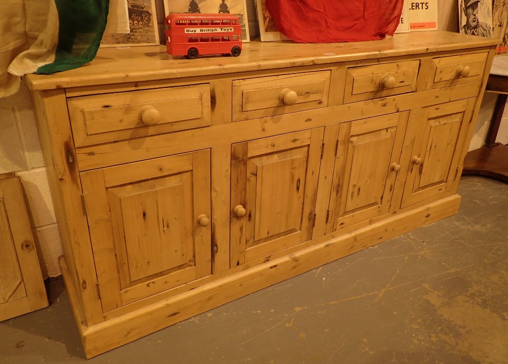 Pine sideboard with four cupboards and four drawers 183 x 43 x 86 cm H