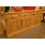 Pine sideboard with four cupboards and four drawers 183 x 43 x 86 cm H