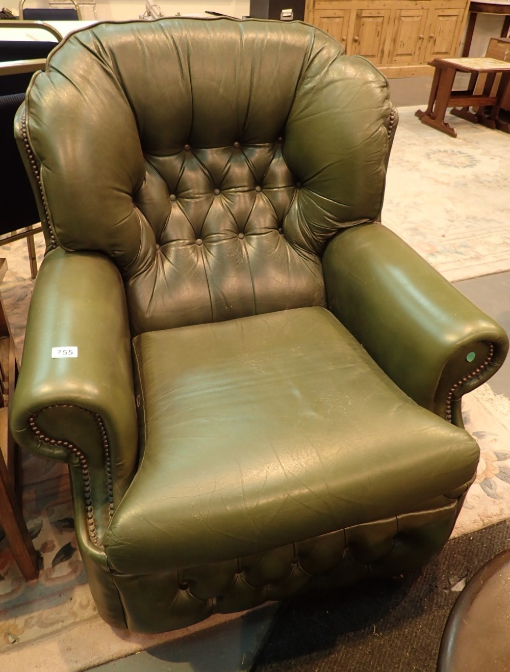 Button back Chesterfield green leather armchair