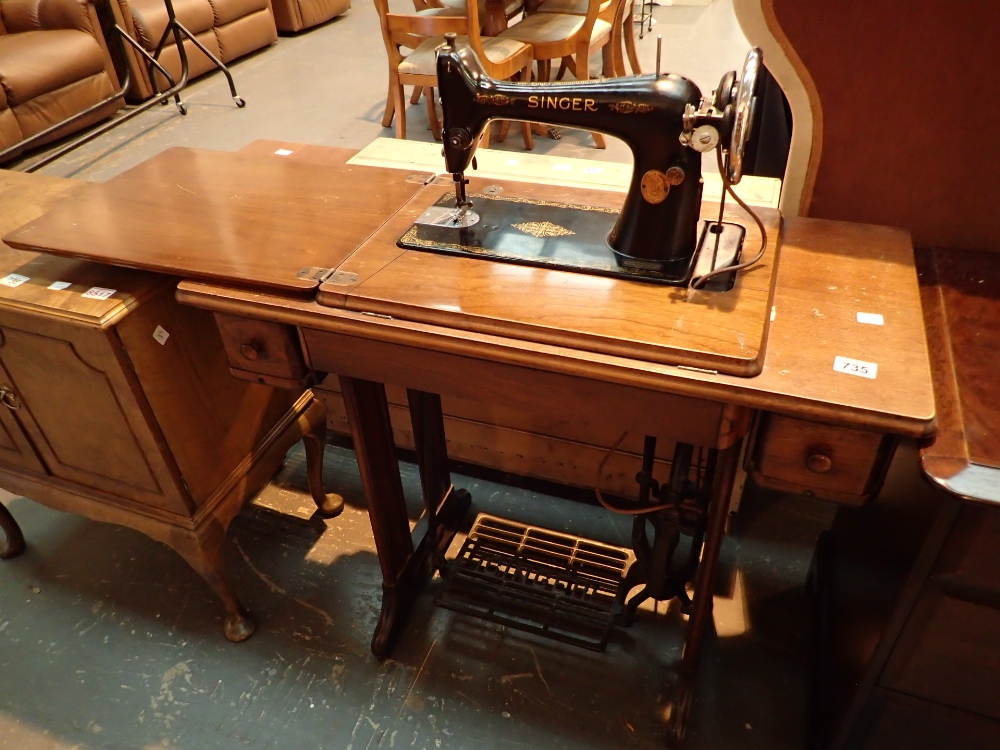 Treadle Singer sewing machine on oak iron base