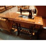 Treadle Singer sewing machine on oak iron base