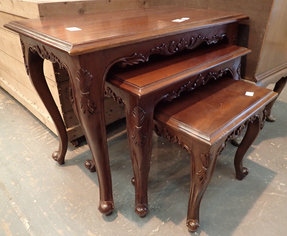 Nest of three vintage mahogany tables with cabriole legs