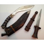 Leather sheathed Indian Kukri knife and a teak handled dagger with leather sheath