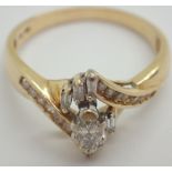 14ct gold diamond cluster ring having a large marquis cut central stone size O / P 3.
