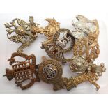 Mixed military cap badges including Royal Scots Dragoon Guard