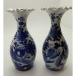 Pair of Japanese Meji period blue and white miniature vases with frilled everted rims and decorated