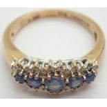 Millennium hallmarked 9ct gold blue topaz and diamond dress ring size N / O 3.