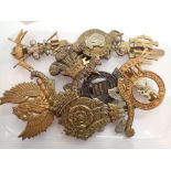 Mixed military cap badges including Ayrshire Yeomanry