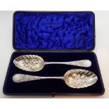 Pair of cased silver plated Victorian berry service spoons