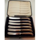 Cased set of silver pistol grip butter knives