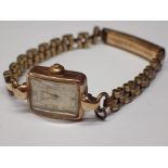 Ladies 9ct gold Rotary wristwatch on a plated bracelet