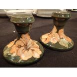 Pair of Moorcroft squat candlesticks in the Coral Hibiscus pattern