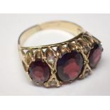 Presumed 9ct gold three stone garnet ring size K 4.