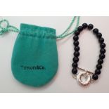 TIFFANY & CO a genuine black onyx bead and sterling silver bracelet with pouch