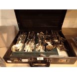 Briefcase containing mixed silver plated cutlery by various makers