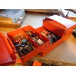 Red cantilever sewing box containing buttons