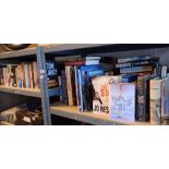 Two shelves of novels factual and illustrated books