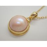 Silver gold plated pearl effect pendant on silver gold plated necklace
