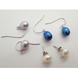 Three pairs of genuine pearl and silver earrings