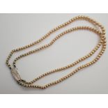 Double strand necklace of faux graduated pearls with sterling silver clasp L: 38 cm