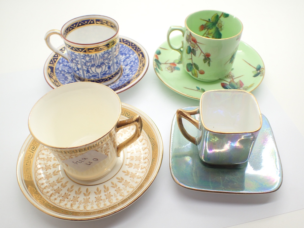 Four cups and saucers including Worcester