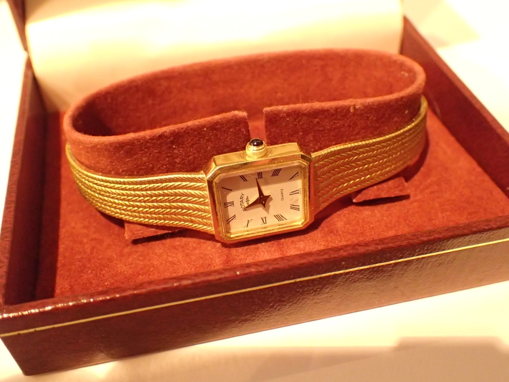 Boxed Rotary ladies quartz wristwatch with gold plated steel case and bracelet white dial