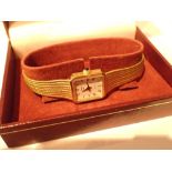 Boxed Rotary ladies quartz wristwatch with gold plated steel case and bracelet white dial