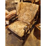 Spindleback rocking chair with upholstered seat and back rest