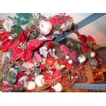 Two shelves of Christmas decorations including wall hanging decorations