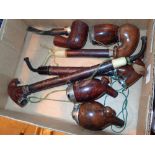 Three Swiss tourist smoking pipes and further pipe parts