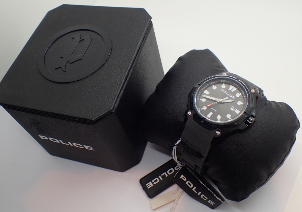 Boxed gents Police wristwach with black dial and date aperture