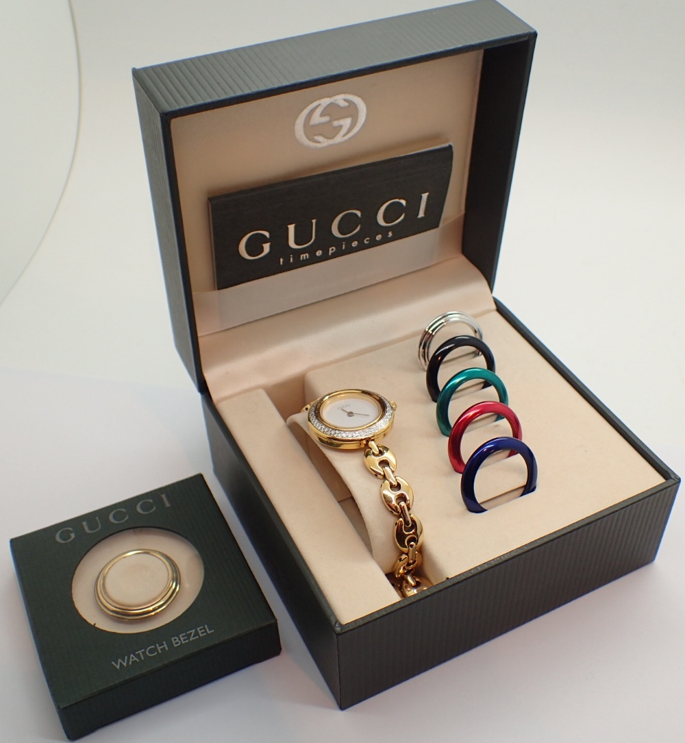 Gucci wristwatch with interchangable bezel CONDITION REPORT: Requires new battery.