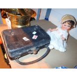 Antique leather bag and doll with hand e