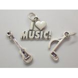 Three sterling silver music charms