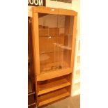 Large stained pine display unit with gla